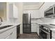 Stylish kitchen with stainless steel appliances and white cabinets provides a modern cooking space at 1701 E Colter St # 223, Phoenix, AZ 85016