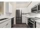 Stylish kitchen with stainless steel appliances and white cabinets provides a modern cooking space at 1701 E Colter St # 223, Phoenix, AZ 85016