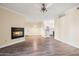 Spacious living room features a fireplace and view to the kitchen at 1701 E Colter St # 223, Phoenix, AZ 85016