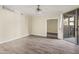 Bright living room with wood floors and a door to the balcony at 1701 E Colter St # 223, Phoenix, AZ 85016