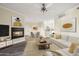 Inviting living room boasts a cozy fireplace, neutral tones, and flows into dining and kitchen at 1701 E Colter St # 223, Phoenix, AZ 85016