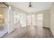 Open-concept living room showcasing doors to the kitchen, bathroom and balcony at 1701 E Colter St # 223, Phoenix, AZ 85016