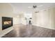 Spacious living room with modern fireplace open to the kitchen and dining area at 1701 E Colter St # 223, Phoenix, AZ 85016