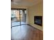 Living room featuring sliding doors and fireplace at 1701 E Colter St # 223, Phoenix, AZ 85016