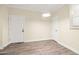 Spacious living area with neutral colors and hardwood style floors at 1701 E Colter St # 223, Phoenix, AZ 85016