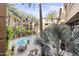 A beautiful pool surrounded by lush palm trees and cozy seating at 1701 E Colter St # 223, Phoenix, AZ 85016