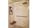 Walk-in shower with marble-look walls and hexagonal floor tile at 1701 E Colter St # 223, Phoenix, AZ 85016