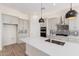 Modern kitchen with center island, stainless steel appliances, and decorative backsplash at 17017 W Baker Dr, Surprise, AZ 85387