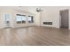 Bright and airy living room featuring tile floors, a fireplace, and plenty of natural light at 17017 W Baker Dr, Surprise, AZ 85387