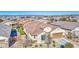 Single story house with tile roof and a two-car garage, in a residential neighborhood at 18216 W Foothill Dr, Surprise, AZ 85387