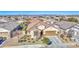 Single-story home with a two-car garage and a nicely landscaped yard at 18216 W Foothill Dr, Surprise, AZ 85387