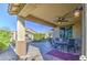 Covered patio with seating area, adjacent to hot tub at 18216 W Foothill Dr, Surprise, AZ 85387