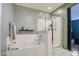 Bathroom with soaking tub and walk-in shower at 18216 W Foothill Dr, Surprise, AZ 85387