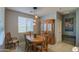 Dining room features wood table and hutch with natural light at 18216 W Foothill Dr, Surprise, AZ 85387