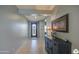 Bright and spacious entryway with tile flooring and dark wood console table at 18216 W Foothill Dr, Surprise, AZ 85387