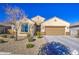 One-story home with desert landscaping and two-car garage at 18216 W Foothill Dr, Surprise, AZ 85387