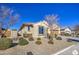 Charming one-story house with front yard landscaping and a two-car garage at 18216 W Foothill Dr, Surprise, AZ 85387