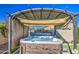 Hot tub with pergola cover, perfect for relaxation at 18216 W Foothill Dr, Surprise, AZ 85387