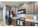 Modern kitchen with stainless steel appliances and granite countertops at 18216 W Foothill Dr, Surprise, AZ 85387