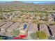 Aerial view of house with solar panels in a residential area at 1828 W Owens Way, Anthem, AZ 85086