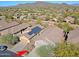 Aerial view of house and surrounding community, mountain backdrop at 1828 W Owens Way, Anthem, AZ 85086