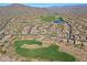 Aerial view of community with golf course and lake at 1828 W Owens Way, Anthem, AZ 85086