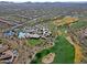 Aerial view showing community amenities including tennis courts and pool at 1828 W Owens Way, Anthem, AZ 85086