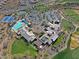 Aerial view showcasing clubhouse, pool, and parking areas at 1828 W Owens Way, Anthem, AZ 85086