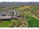 Aerial view of community with golf course, pool, and clubhouse at 1828 W Owens Way, Anthem, AZ 85086