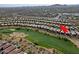 Aerial view of house and surrounding golf course community at 1828 W Owens Way, Anthem, AZ 85086