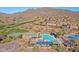 Aerial view of community pool, tennis courts, and clubhouse at 1828 W Owens Way, Anthem, AZ 85086