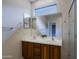 Double vanity bathroom with large mirror and shower at 1828 W Owens Way, Anthem, AZ 85086