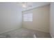 Well-lit bedroom featuring ceiling fan and carpet at 1828 W Owens Way, Anthem, AZ 85086