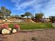 Impressive entrance to Anthem at Del Webb community featuring a water feature and landscaping at 1828 W Owens Way, Anthem, AZ 85086