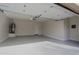 Attached garage with epoxy flooring and ample storage at 1828 W Owens Way, Anthem, AZ 85086