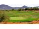 Scenic golf course view with mountain backdrop at 1828 W Owens Way, Anthem, AZ 85086