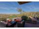 Relaxing patio furniture overlooking the golf course at 1828 W Owens Way, Anthem, AZ 85086