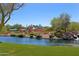 Colorful playground by the lake with various play structures at 1828 W Owens Way, Anthem, AZ 85086