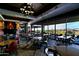 Upscale restaurant interior with large windows, modern furnishings, and a fireplace at 1828 W Owens Way, Anthem, AZ 85086