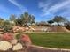 Landscaped area with a waterfall feature at 1828 W Owens Way, Anthem, AZ 85086