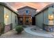 Courtyard entry with stone accents and pergola at 18311 W East Wind Ave, Goodyear, AZ 85338