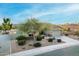 Single-story home with desert landscaping and a three-car garage at 18311 W East Wind Ave, Goodyear, AZ 85338