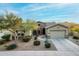 Single story home with desert landscaping at 18311 W East Wind Ave, Goodyear, AZ 85338