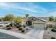 Single story home with desert landscaping at 18311 W East Wind Ave, Goodyear, AZ 85338