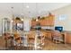 Modern kitchen with curved island, granite countertops and stainless steel appliances at 18311 W East Wind Ave, Goodyear, AZ 85338