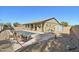 Large backyard pool with patio and shed at 18311 W East Wind Ave, Goodyear, AZ 85338