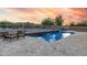 Relaxing backyard pool with patio and seating area at 18311 W East Wind Ave, Goodyear, AZ 85338