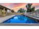 Inviting rectangular pool in a desert landscape at 18311 W East Wind Ave, Goodyear, AZ 85338