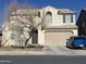 Two-story house with a large garage and a landscaped front yard at 18656 W Raymond St, Goodyear, AZ 85338