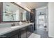 Double vanity bathroom with a large mirror and modern finishes at 19447 S 209Th Pl, Queen Creek, AZ 85142